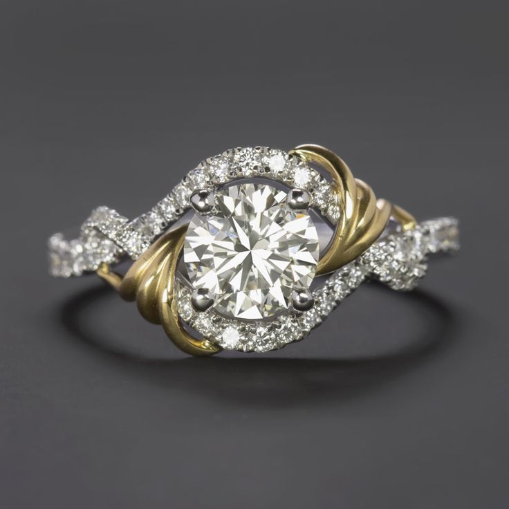 an engagement ring with two tone gold and white diamonds