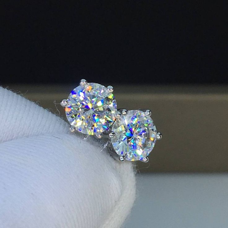 This is made-to-order item, it takes about 6-8 weeks to deliver your earrings after order is placed, thank you. If you are interested in earrings with other carat (0.5, 1, 1.5, 2, 2.5, 3 carats or larger) moissanite diamond, please send me a message to get a price quote. Lab created Moissanite diamond in six prong setting. 18K solid white gold stud earrings, also available in 18K rose gold or 18K yellow gold. Classic design, push back post. Moissanite diamond: -Color: D (colorless); -Clarity: VV Dazzling Diamond White Diamond Earrings For Gift, Luxury Oval Bridal Earrings With Prong Setting, Moissanite Bridal Earrings For Gift, Exquisite Oval Prong-set Earrings, Exquisite Oval Prong Set Earrings, Exquisite Oval Earrings With Prong Setting, Gift Moissanite Earrings With Round Cut, Anniversary Diamond Cut Sterling Silver Cluster Earrings, Gift Round Diamond White Cluster Earrings