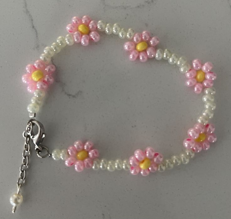 Hand Beaded dainty unique white/pink coloration glass bead bracelet.  Great gift to give or for yourself!  Fun to wear or give!  Perfect for daughter or granddaughter!  Adjustable length up to 7.5" Each bracelets is unique & individually handcrafted. Handmade White Pearl Bracelet For Friendship, Pink Round Beaded Bracelets For Birthday, Handmade White Pearl Bracelet, Cute Handmade White Pearl Bracelet, Cute White Handmade Pearl Bracelet, Pink Beaded Bracelets With 8mm Beads For Birthday, Adjustable Pink Pearl Bracelet Gift, Cute Adjustable White Pearl Bracelet, Handmade White Pearl Bracelet With Flower Shape