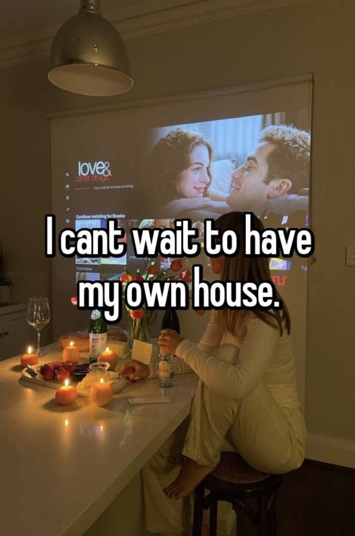 a man and woman sitting at a bar with candles on the counter in front of them