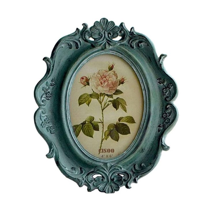 an ornate frame with a pink rose painted on it