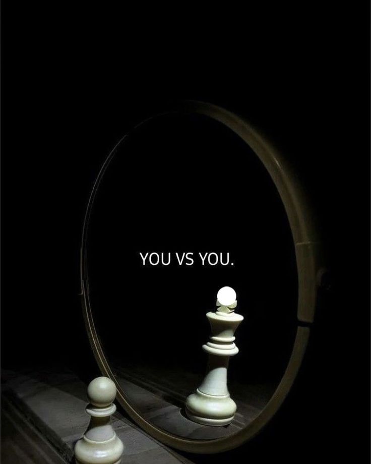 a mirror that has chess pieces in front of it with the words you vs you