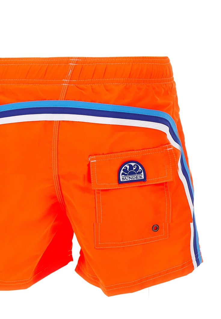 Sundek 'Boardshort' men's swimsuit, fluo orange, contrasting color profiles, low elastic waist with night-white drawstring and logoed ends, two side welt pockets, one back pocket with velcro and applied logo patch, regular fit. Composition: 100% Poliammide Orange Beachwear Shorts, Orange Short Swim Trunks For Beachwear, Sporty Swimming Shorts With Side Pockets, Orange Sporty Swimwear For Pool, Orange Short Swim Trunks, Orange Nylon Sports Swimwear, Orange Swim Trunks For Beach Sports, Orange Sports Swimwear For Beach Season, Sporty Orange Swim Trunks For Summer