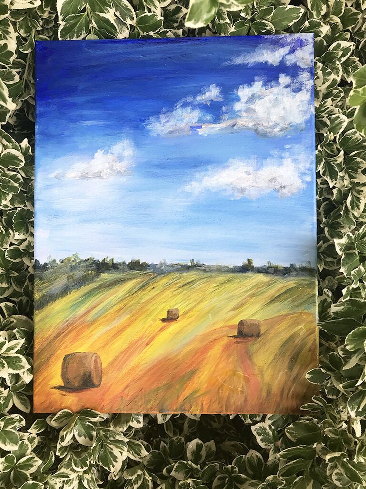 a painting of hay bales in a field with blue sky and clouds above it