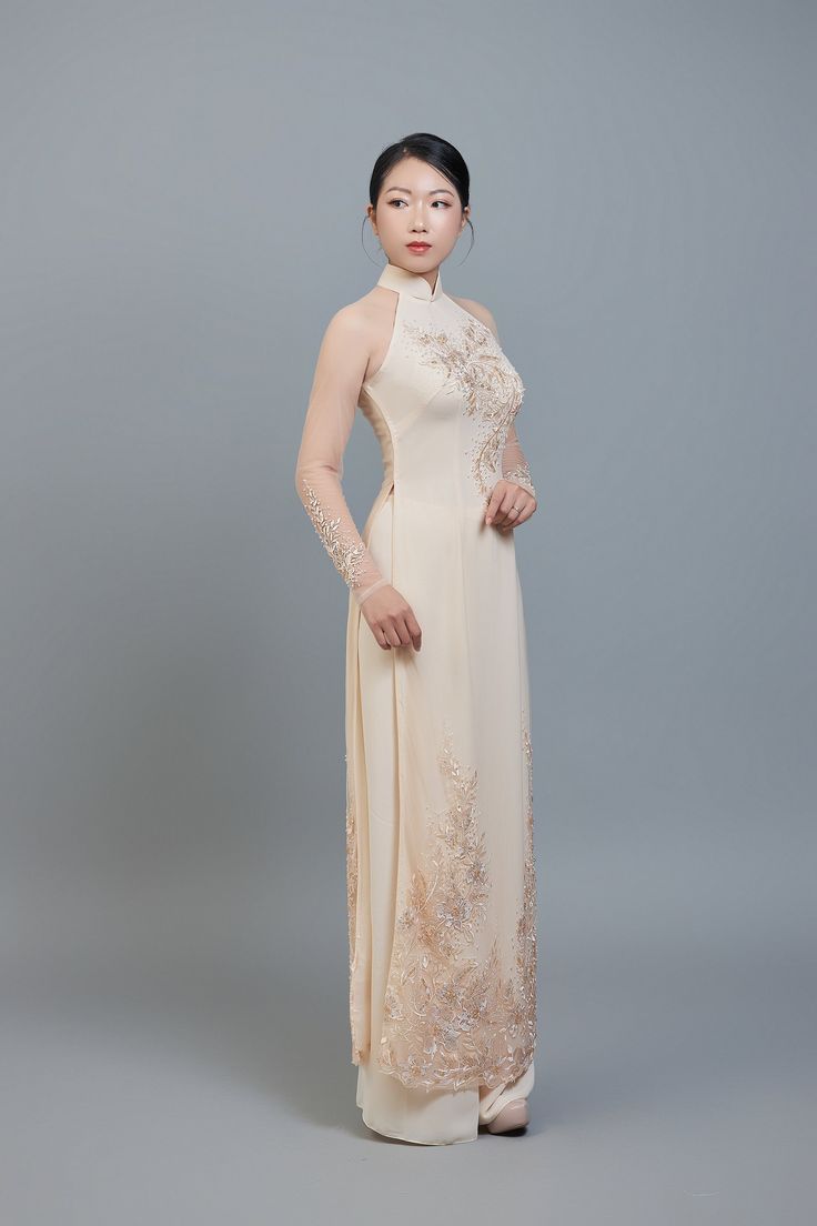 Custom made ao dai (Vietnamese traditional dress) champagne color chiffon (price includes pants worn underneath ao dai dress). After ordering we will send you a quick and simple form to guide you through taking the measurements we require for an amazing fit. Shipping details: Please allow 3-4 weeks for custom making and shipping, once measurements are received. Colors: Please note; we make every effort to ensure our photos accurately represent the true colors of each garment, but due to the natu Champagne Ao Dai, Elegant Ao Dai With Lace Sleeves For Wedding, Elegant Wedding Ao Dai With Lace Sleeves, Ceremonial Ao Dai With Lace Sleeves, Fitted Ao Dai With Lace Sleeves For Wedding, Elegant Ao Dai With Lace Sleeves For Ceremony, Traditional Beige Lace Dress, Traditional Fitted Beige Gown, Elegant Beige Gown With Intricate Embroidery