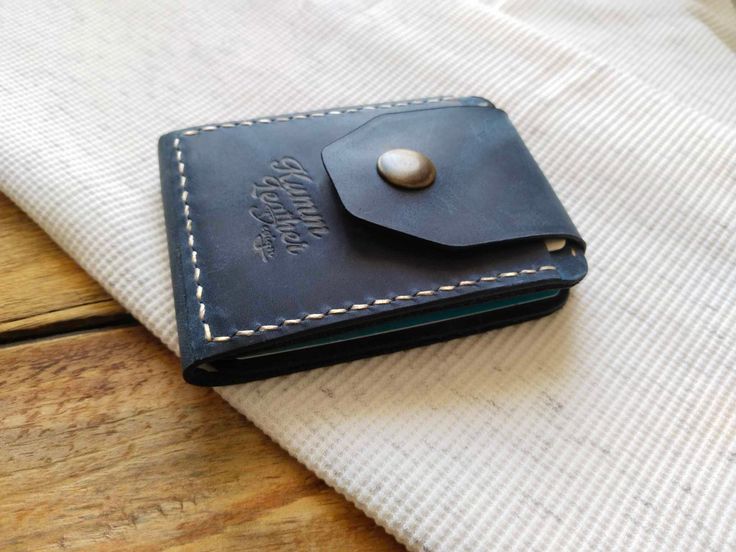 Genuine leather wallet for men, blue color and snap-on. It has a minimalist and elegant design. It is easy and practical to use. It does not take up space in your pocket or bag. You can also choose it as a gift. Show off your style and dazzle with this wallet! Card And Money Holder ( Five Card Capacity ) Wallet Sizes  105mm.  x  75mm. Rectangular Trifold Wallet With Snap Closure As Gift, Bifold Coin Purse With Snap Closure As Gift, Vintage Black Trifold Wallet For Gifting, Vintage Rfid Blocking Wallets For Gifts, Vintage Rfid Blocking Wallets As Gift, Vintage Black Trifold Wallet As A Gift, Vintage Black Trifold Wallet As Gift, Trifold Card Holder With Coin Pocket For Gift, Trifold Card Holder With Coin Pocket As Gift