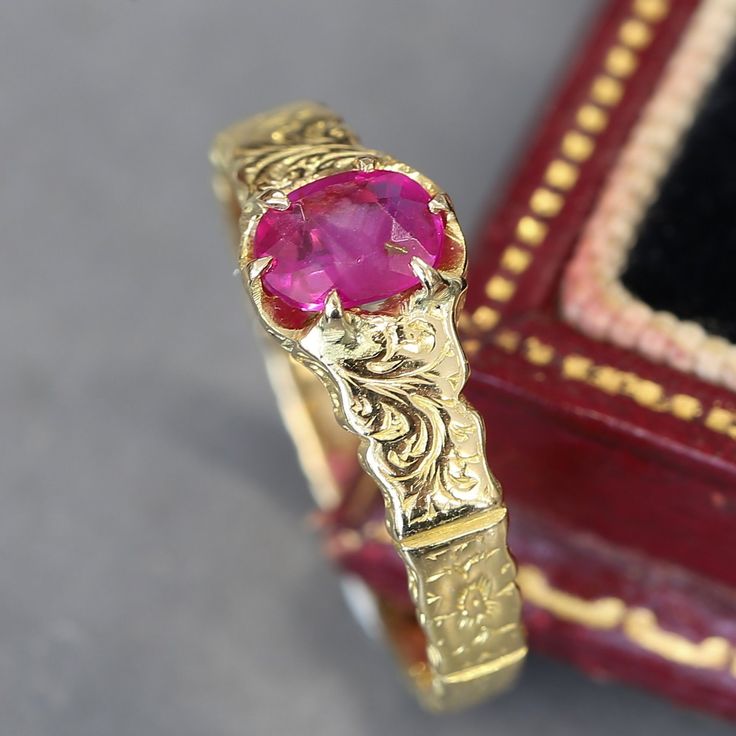 This is an antique 18ct yellow gold ruby ring. The band of the ring features a delicately hand engraved pattern which goes the whole way around the band. The ruby is a mid red hue with a slight pink undertone and has a couple of noticeable inclusions. Condition: Used (Very Good) Weight: 2.8 grams Size: L (51) Ruby: Approx. 0.50 carats Tested As: 18ct Gold Period: Victorian Box: Plain gift box If you have any questions regarding my items, just send me a message and I will get back to you as soon Oval Diamond Cut Ruby Ring, Ceremonial Yellow Gold Emerald Heirloom Ring, Ceremonial Heirloom Yellow Gold Emerald Ring, Heirloom Yellow Gold Engraved Emerald Ring, Classic Ruby Ring With Diamond Cut, Antique Ruby Ring With Rose Cut Diamonds, Heirloom Engraved Emerald Ring In Yellow Gold, Yellow Gold Emerald Ring With Intricate Design, 14k Yellow Gold Ruby Ring With Intricate Design