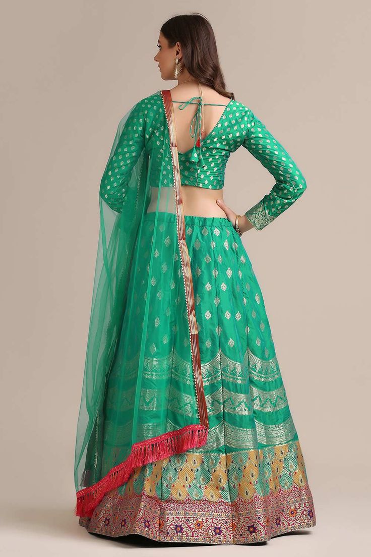 color-green, fabric-jacquard, work-gold woven, brand-name-krupali-savani,occasion-festivewear, occasion-wedding-guest, womenswear,ideal-for-women, lehengas, Product Features: Color: Green Lehenga Fabric: Jacquard Silk Choli Fabric: Jacquard Silk Work: Gold Woven Sleeves: Full Sleeves Neck Type: V Neck Wash Care: Dry Clean Occasion: Festivewear, Wedding Guest Product Type: Lehenga Choli with Dupatta Disclaimer: There will be slight difference in digital to actual image Green Anarkali Set With Unstitched Blouse For Festive Occasions, Festive Green Anarkali Set With Unstitched Blouse, Green Semi-stitched Anarkali Set With Unstitched Blouse, Green Chanderi Lehenga With Unstitched Blouse, Green Art Silk Salwar Kameez For Party, Green Chanderi Choli For Transitional Season, Semi-stitched Green Choli For Eid, Festive Reception Salwar Kameez In Brocade, Festive Brocade Salwar Kameez For Reception