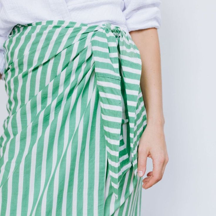 The sarong is the best accessory for your days at the pool or beach. And takes up zero room in your suitcase when you're packing for your beach vacation! Breezy, comfortable, and versatile our Green and White Stripe Vienna Sarong can be worn tied around the waist or even tied around the neck as a dress. Monogram Timeline: Please note the monogram process takes up to one week prior to shipment. Details and Care Measures 44" x 76"Very lightweight 100% cottonCare Instructions: Hand wash separate in Baby Bubble Romper, Bonnet Cap, Baby Bubble, Bubble Romper, Romper Dress, Garment Bags, Hair Accessories Jewelry, Sarong, Outerwear Sweater