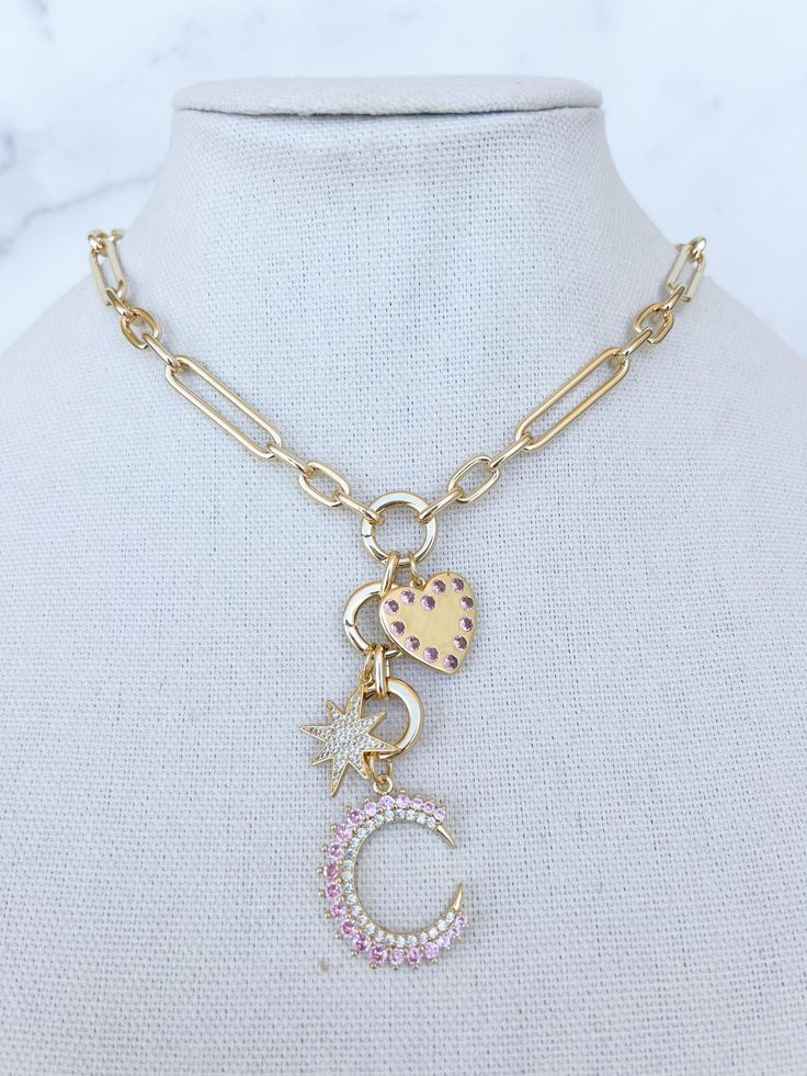 This gold filled charm necklace will be your every day staple! Detailed with beautiful pink and clear stone charms (that are removable) and closed with a large lobster clasp that can adjust on different lengths of the chain!  We offer this piece in various colors: * pink * light blue * dark blue Necklace Gold Chain, Heart Charm Necklace, Gold Filled Necklace, Necklace Chunky, Gold Charm Necklace, Clear Stone, Chunky Necklace, Pink Light, Gold Chain Necklace