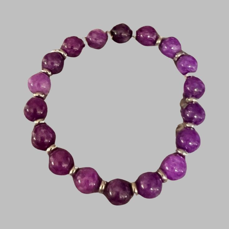 Amethyst bracelet featuring February birthstone Purple Amethyst Bead Jewelry, Silver Amethyst Beaded Bracelets For Meditation, Purple Gemstone Beaded Bracelets In Sterling Silver, Handmade Amethyst Stretch Bracelet In Purple, Silver Amethyst Crystal Bracelet With 8mm Beads, Silver Amethyst Bracelet With 8mm Beads, Purple Gemstone Stretch Bracelet With Round Beads, Adjustable Amethyst Stretch Bracelet In Purple, Silver Amethyst Beaded Bracelets With Natural Stones