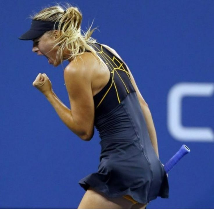 a female tennis player celebrates her victory on the court