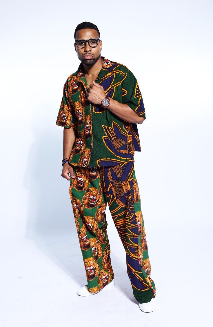 PRODUCT DETAILS: Designed in the U.S., hand-crafted in Africa Delivery within 2 weeks Multiple prints available This exceptional, Igbo Traditional multi-colored shirt and pants set, made of unique cotton African Isi Agu print fabrics, will make you stand out with the pops of color and provide a nice, laid back sense of style! This unisex shirt & pant can be worn as evening wear to various events such as weddings, dinner parties and other formal occasions. FABRIC CARE: Dry Clean. Hand Wash. Machine Wash. SIZE CHART: Casual Printed Cotton Sets, Casual Patterned Cotton Sets, Casual Multicolor Sets Relaxed Fit, Cotton Graphic Print Patterned Sets, Casual Multicolor Relaxed Fit Sets, Patterned Cotton Sets With Graphic Print, Green Short Sleeve Sets With Graphic Print, Green Graphic Print Short Sleeve Sets, Green Graphic Print Sets With Short Sleeves