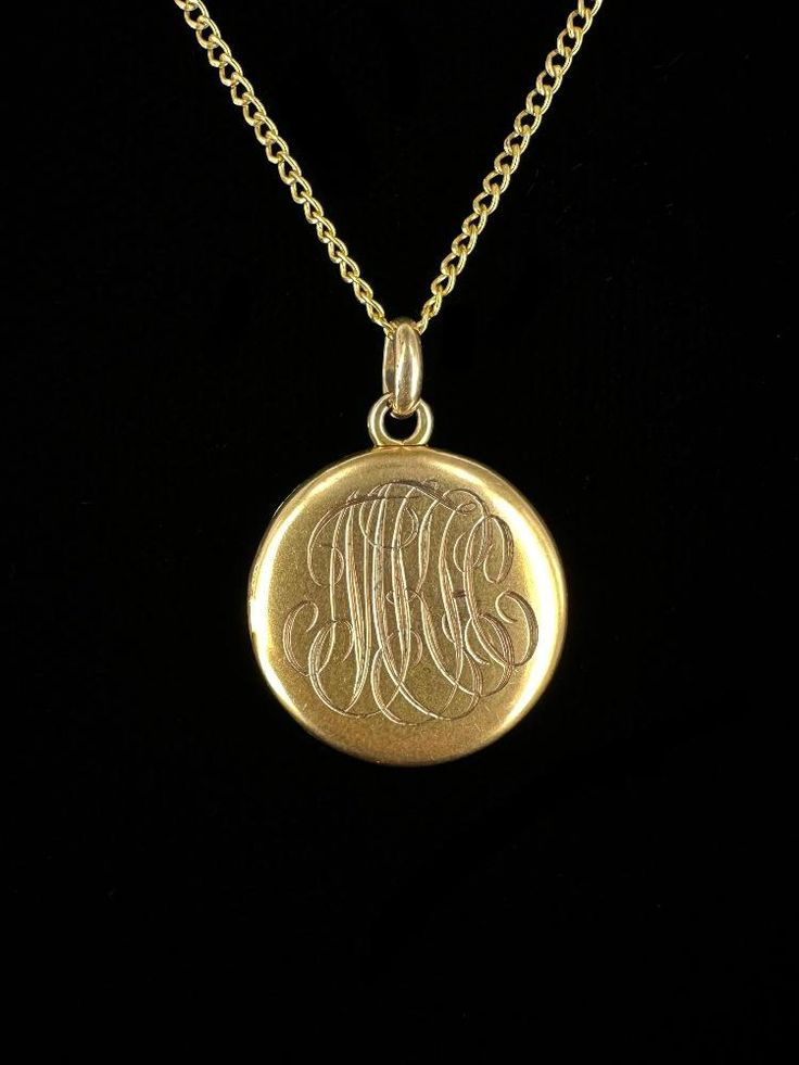 Antique Victorian 10k Gold Initial Engraved Picture Locket Necklace 18"  Item here is an antique Victorian 10k gold initial engraved picture locket necklace. This pendant is unmarked but tests for 10k gold and hangs on a 12k gold filled chain that closes with a spring ring. The initials appear to say "MKH", but are hard to make out due to the font. Locket includes two pictures of a couple from the early 1900's. Very cool and well made gold locket.  Condition: Good; item is pre-owned and may have some signs of light use and age related wear. Please look closely at the pictures provided as they are an extension of our written description. Measurements: Chain Length: 18 in Chain Width: 1.2 mm Locket: ¾ in, 1.5 dwt Weight: 3.5g 9010F Luxury Ornate Oval Pendant Necklace, Antique Gold Locket Necklace Stamped 14k, Antique Gold Engraved Jewelry As A Gift, Antique Gold Engraved Jewelry Gift, Antique Gold Engraved Jewelry For Gift, Heirloom Style Jewelry With Vintage Charm, Etched Coin Jewelry For Anniversary, Antique Coin Jewelry Gift, Heirloom Gold Jewelry With Vintage Charm