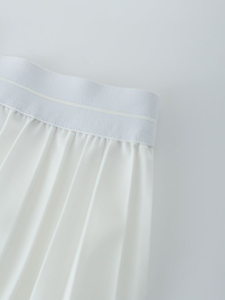 Our best selling Pleated skirt is back in all new colors! This easy to wear skirt can be dressed up or down, depending on the occasion, and is a must-have for your wardrobe. White Relaxed Pleated Skirt With Elastic Waistband, White Fitted Maxi Skirt With Elastic Waistband, Elegant White Skirt With Elastic Waistband, Elegant Skort With Elastic Waistband And Relaxed Fit, Elegant Stretch Tennis Skirt, Elegant White Tiered Pleated Skirt, White Flared Mini Skirt With Elastic Waistband, White Stretch Pleated Skort, Chic White Maxi Skirt With Elastic Waistband