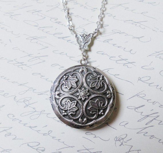 The antique silver plated floral engraved locket is 32mm. An antique silver Renaissance style pattern adorns the front of this locket. The locket is connected to a 24 inch chain by a rosary style connector. The locket is packaged in a lovely little silhouette box, set on a soft piece of white cotton.•••••••••••••••••••••••••••••••••••••••••••• ♥ • ♥ • ♥ • ♥ • ♥ • ♥ • ♥ • ♥ ••••••••••••••••••••••••••••••••••••••••••••••© Original design by Twilight's CastleThank you for visiting!Twilight's Castle Silver Medallion Necklace For Anniversary Gift, Victorian Etched Locket Necklace As Gift, Victorian Etched Locket Necklace For Gift, Victorian Etched Locket Necklace Gift, Antique Silver Sterling Silver Vintage Locket Necklace, Ornate Medallion Locket Necklace With Vintage Charm, Victorian Silver Locket Necklace, Victorian Engraved Necklaces For Anniversary Gift, Ornate Engraved Antique Silver Locket Necklace