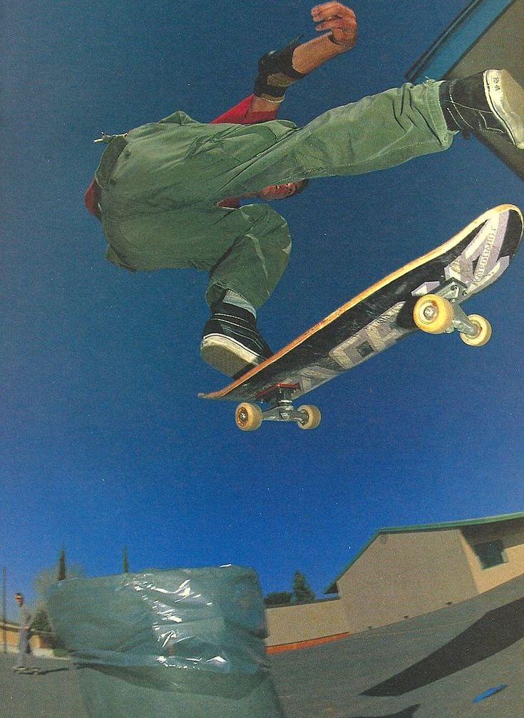 a man flying through the air while riding a skateboard