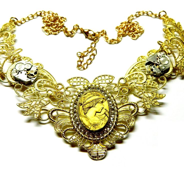 Golden metal lace collar, steampunk necklace choker, including two old miniature clockworks, Gray-black or Golden or beige-cream colored Goth Lady cameo woman with the rose or hat. On your request with or without clockworks. All parts are of high quality. Dimensions of the collar 5" x 5" / 12.5 cm x 12.5 cm Length of the chains 14" (+2") / 35 cm (+ 5 cm) Cameo 1" x 3/4" / 2.5 cm x 2 cm Clockworks 5/8" / 1.5 cm more: https://www.etsy.com/shop/EmilySteampunk?section_id=19893317 Please take a momen Steampunk Wedding, Punk Jewelry, Steampunk Necklace, Metal Lace, Jewelry Choker, Birthday Jewelry Gift, Lace Collar, Cream Color, Happy Shopping