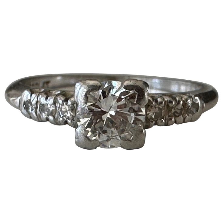 Handcrafted in the 1940s in platinum, this stunning Mid-century ring is designed around an Old European cut diamond center stone measuring approximately 0.50 carats, H color, SI1 clarity, and flanked by six single cut diamonds, three on each side, totaling approximately 0.10 carat, H color, SI clarity. Platinum Diamond Engagement Rings, Platinum Engagement Rings, European Cut Diamonds, Jewelry Rings Engagement, Ring Verlobung, Diamond Cuts, Platinum, Jewelry Rings, Engagement Rings