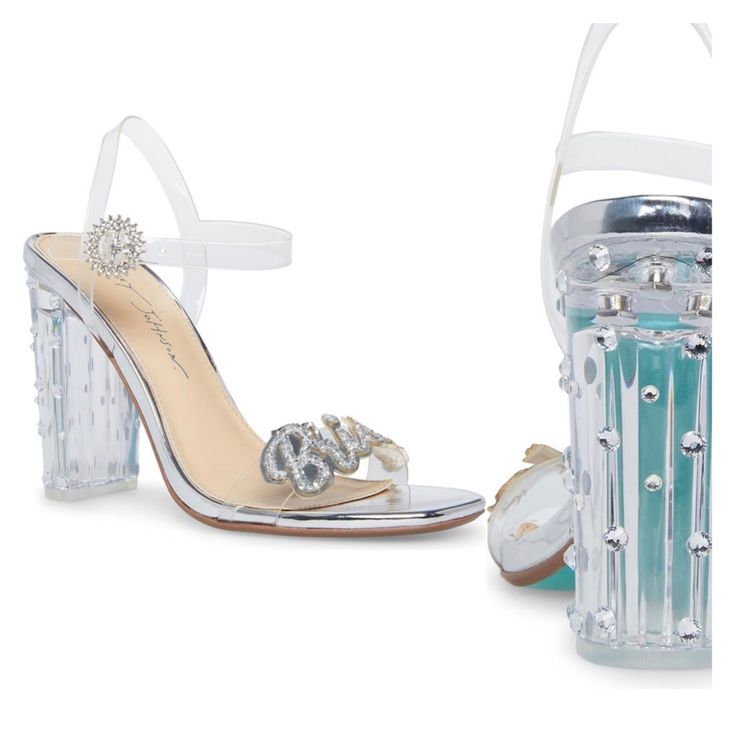 A Clear Block Heel And Sparkling Embellishment Bring A Glamorous Energy To This Runway-Ready Sandal. 3.75" Heel Adjustable Ankle Strap With Buckle Closure Cushioned Insole Open Toe Slingback Block Heel Lucite Upper/Manmade Sole Imported Formal Clear Sandals With 4-inch Heel, Summer Formal Wedding Shoes With Rhinestones, Glamorous Clear Ankle Strap Sandals, Glamorous Clear Open Toe Sandals, Open Toe Synthetic Wedding Shoes For Party, Synthetic Open Toe Wedding Shoes For Party, Clear Open Toe Heels For Prom, Glamorous Clear Sandals For Wedding, Glamorous Synthetic Wedding Shoes With 4-inch Heel