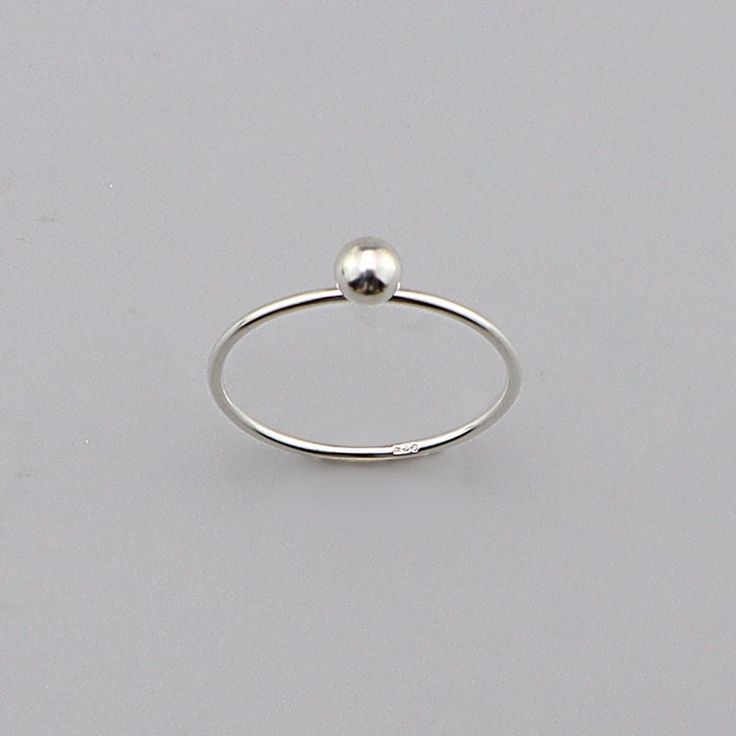 Sterling Modernist Ball Ring, Minimalist Sterling Ring, Silver charm Ball Ring Jewelry CODE: PLSRG92 Material: 925 Sterling Silver Finishing: silver Weight: 0.72 gram Ring size: 6,7,8 available Price per piece Minimalist Sterling Silver Ball Ring for Everyday Elegance" its made by hand This understated silver ring features a smooth, spherical design--a true embodiment of simplicity and timeless style. Crafted from 925 sterling silver, it's perfect for those who appreciate effortless elegance.  H Minimalist Sterling Silver Promise Ring, Silver Minimalist Stackable Jewelry, Minimalist Silver Stackable Open Rings, Adjustable Silver Stackable Minimalist Rings, Adjustable Minimalist Silver Stackable Rings, Minimalist Adjustable Silver Stackable Rings, Minimalist Stackable Open Rings Stamped 925, Nickel-free Silver Minimalist Stackable Rings, Minimalist Nickel Free Round Band Jewelry