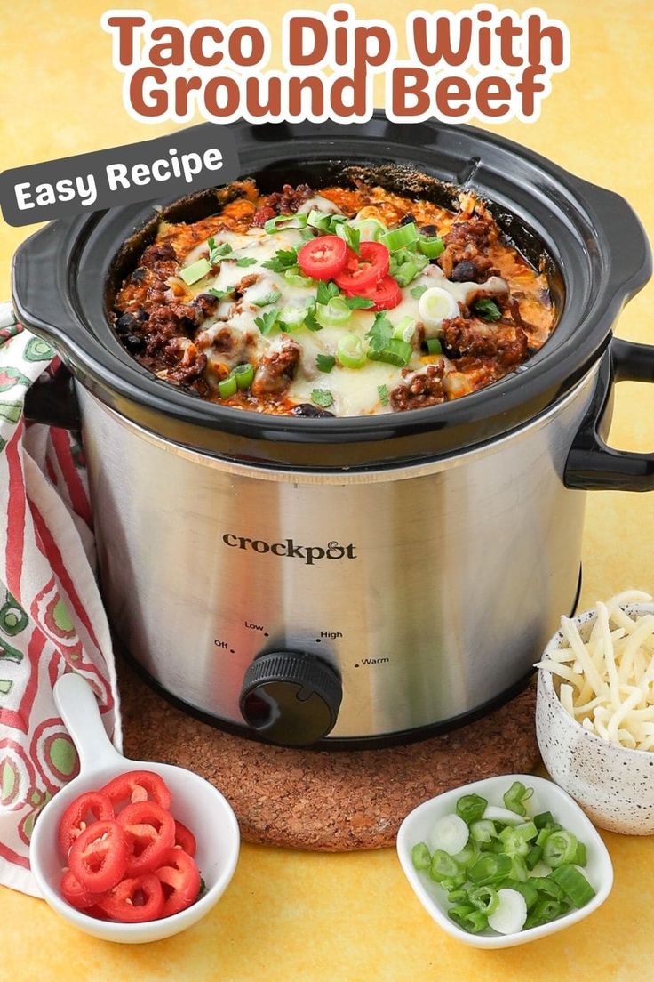 an easy recipe for taco dip with ground beef in the crockpot is ready to be eaten