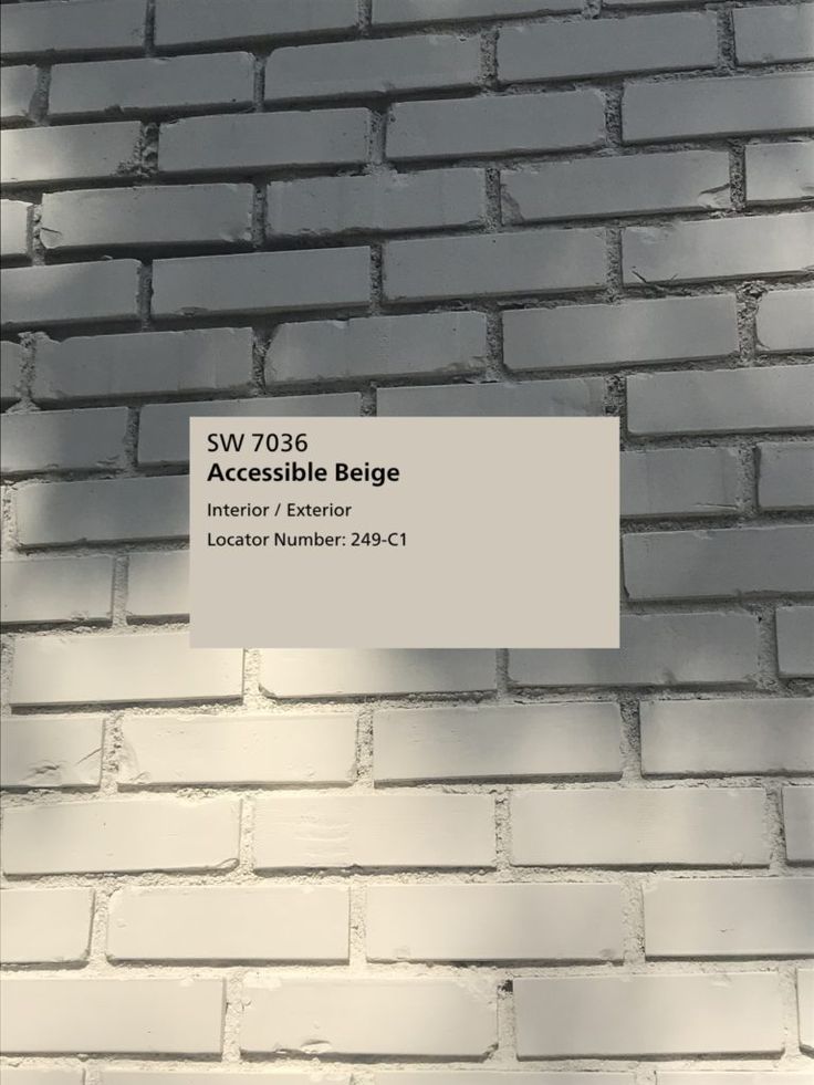 a white brick wall with the words swi 7038 accessible begge