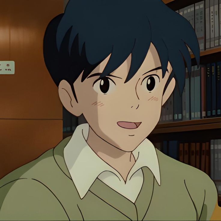 an anime character with black hair and green sweater in front of bookshelves, looking at the camera