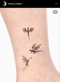 two small dragon tattoos on the ankle