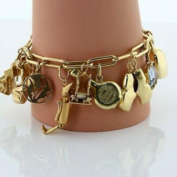 Massive Charm Bracelet set in 14K Yellow Gold , x19 charms, worldwide and whimsey, including enamel and stone set, 7 inch, 68.8 grams Stock # BB454BAM06 This listing contains photographs of the actual item you will receive. Our items are in excellent condition with little or no signs of wear and many are one of a kind pre-owned estate finds. Please look closely at the pictures in this listing as they are part of the product description. Please read the description, as any imperfections or condit Luxury Gold-tone Charm Jewelry, Luxury Metal Jewelry With Removable Charms, Yellow Gold Vintage Charm Metal Charms, Yellow Gold Metal Bracelet With Vintage Charm, Yellow Gold Vintage Metal Charms, Yellow Gold Vintage Charm, Vintage Yellow Gold Jewelry With Logo Charm, Luxury Gold Jewelry With Vintage Charm, Luxury Yellow Gold Jewelry With Vintage Charm