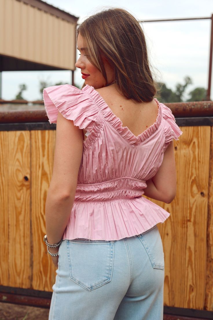 We are here for all the colors this season & this lavender top is so cute! Features a v-neck, ruffle hem & sleeve, elastic waist & raw edge. 100% Cotton Jacie is 5'4", a size 26 & 34B wearing a small Casual V-neck Ruffled Crop Top, Fitted V-neck Ruffle Crop Top, Feminine V-neck Puff Sleeve Top With Ruffles, Bohemian V-neck Blouse With Ruffles, Vogue Home, Lavender Tops, Bohemian V-neck Top With Ruffle Hem, Rodeo Drive, Ruffle Hem