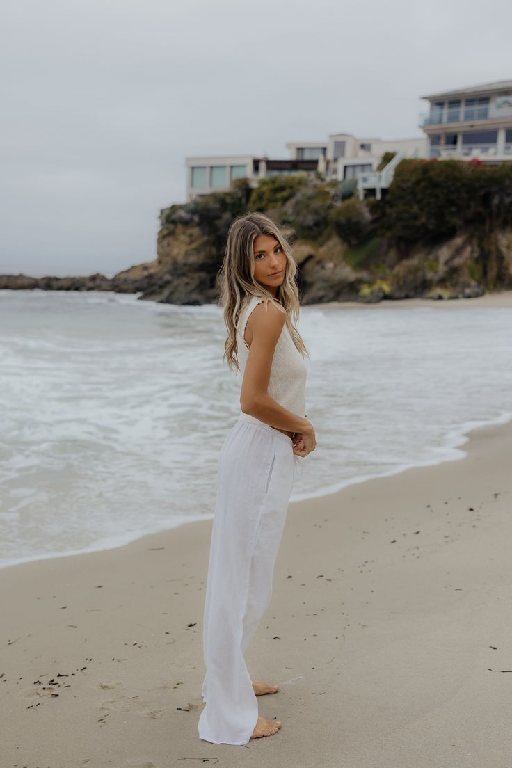 We went on a search for the perfect drawstring linen pants, and WE FOUND THEM. These are so versatile, lightweight, comfy and the highest quality. They are 100% linen which means they are durable and will last you a lifetime! You will be living in these pants for years! Model Info: Taylor is 5'9 wearing size Small. Paired With: Capri Knit Vest Top Also available in Black: Bondi Linen Pants // Black Fabric Info: 100% Linen Breezy White Linen Bottoms, White Breezy Linen Bottoms, Breezy Linen Bottoms With Relaxed Fit, Relaxed Linen Pants For Beach, Summer Linen Straight Leg Pants, Summer Straight Leg Linen Pants, Breezy Linen Beach Bottoms, Breezy Linen Bottoms For The Beach, Linen Pants Black