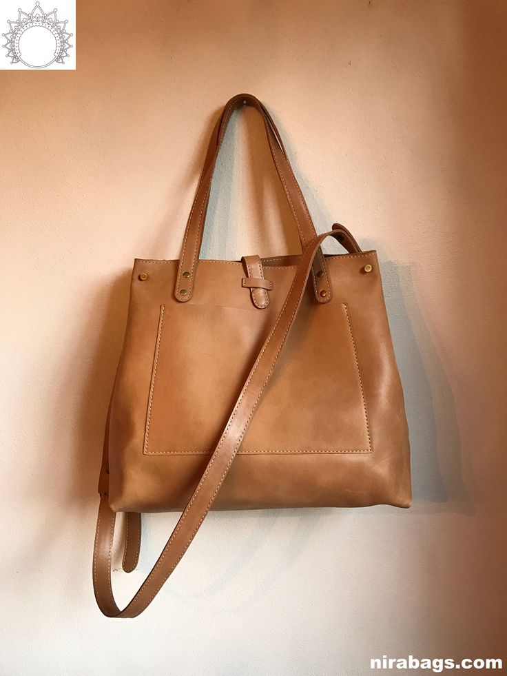 "Comfortable cross body Tote with detachable / adjustable strap * Utility tote bag that can be an everyday staple * Interior dual pocket * 15\" x 13\" x 5.5\"  |  11.5\" handle drop to top of bag  |  ~2.5 lbs 100% cuero natural. Hecho a Mano en Colombia, in artisanal workshops Qs / comments: info at nirabags.com" Modern Everyday Crossbody Satchel, Bucket Satchel With Top Carry Handle For On-the-go, Daily Use Bucket Satchel With Top Carry Handle, Everyday Satchel With Detachable Top Handle, Everyday Satchel With Double Handle, Classic Shoulder Bag With Detachable Handle For Everyday Use, Modern Briefcase Tote With Adjustable Strap, Double Handle Satchel With Detachable Strap, Daily Double Handle Satchel With Detachable Strap