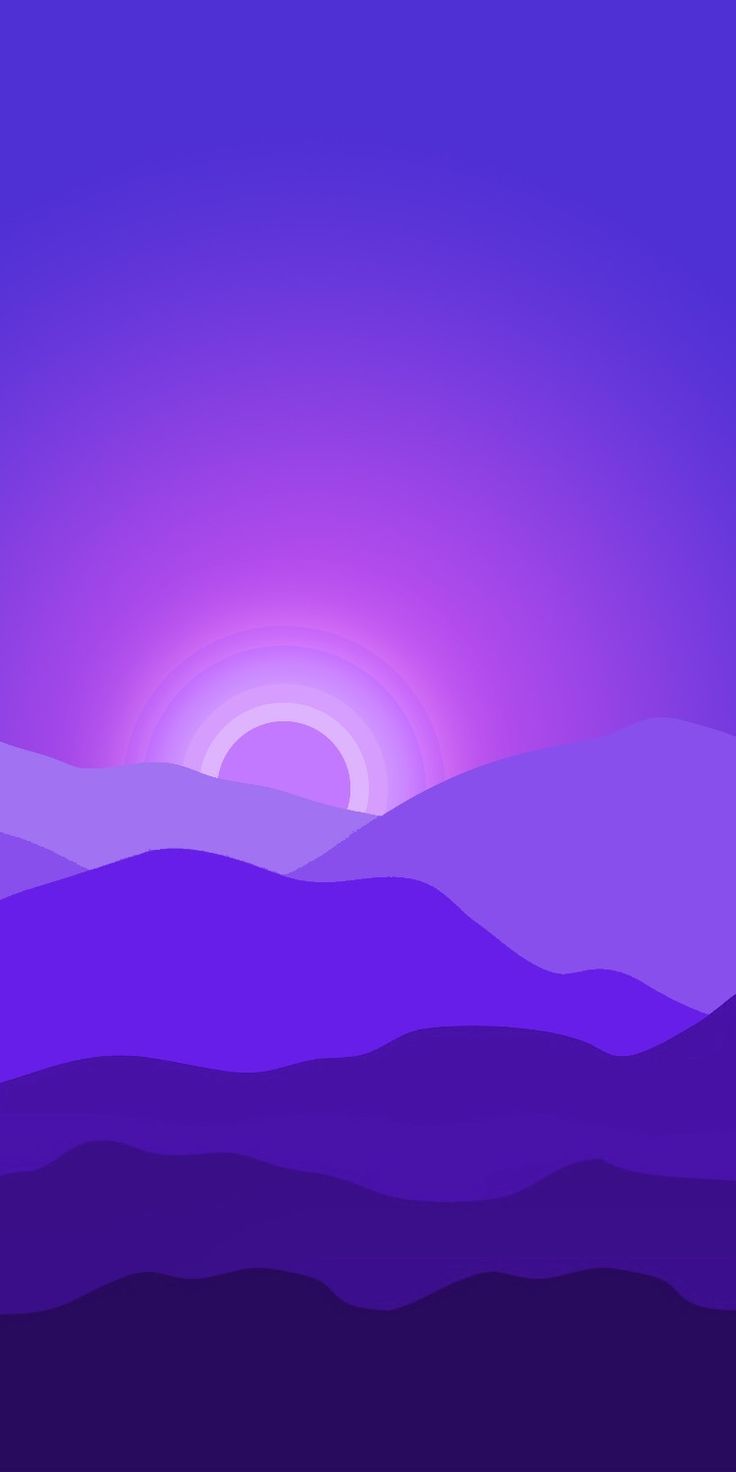 the sun is setting over some mountains in the distance, with purple and blue hues