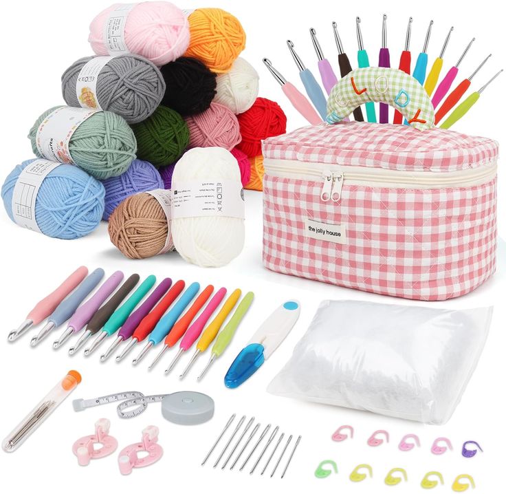 an assortment of knitting supplies including crochet hooks, needles, and yarns