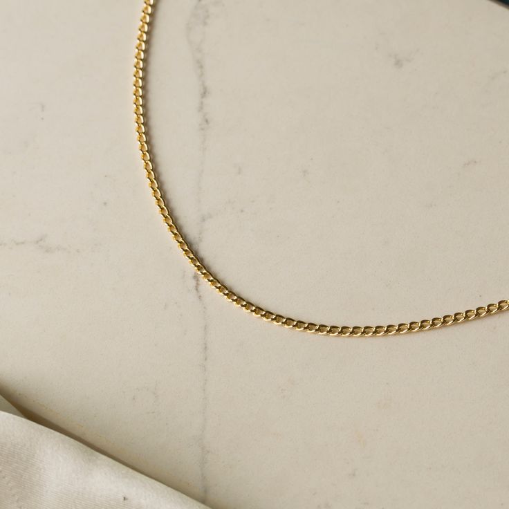 Our 14K Real Gold Miami Cuban Curb Chain Link Necklace is the epitome of timeless style and sophistication. Handcrafted from genuine 14K solid gold, this necklace features the iconic Miami Cuban design known for its bold and elegant appearance. The semi-hollow link construction strikes the perfect balance between a substantial look and lightweight comfort, making it suitable for both everyday wear and special occasions. Available in a range of widths from 2.0mm to 6.2mm and lengths from 16 to 24 inches, this versatile necklace can be customized to perfectly fit your personal style and preferences.Key Features: Classic Miami Cuban Design: Offers a bold, elegant look with its distinct link style, perfect for both casual and formal wear. Versatile Width Options: Available in 2.0mm, 2.8mm, 5.0