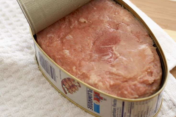 an open can of food sitting on top of a table