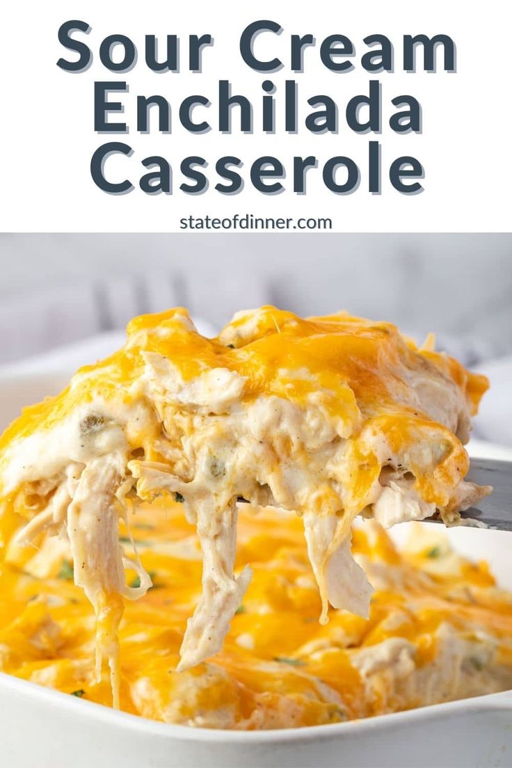 chicken enchilada casserole in a white dish with a serving spoon