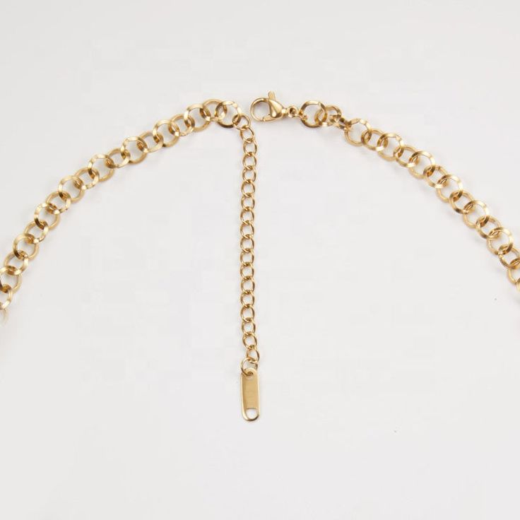 Introducing the Juliette necklace, a stunning piece that is sure to turn heads. Crafted with care, this necklace boasts an elegant and timeless design that is perfect for any occasion. The linked chain measures 15 inches with an additional 2 inches to allow for a comfortable fit on any neck. The necklace is made of high-quality 18k gold plating that not only looks beautiful but also ensures durability for long-lasting wear. The pendant features a delicate and stunning mother of pearl detail, whi Elegant Metal Charm Necklace With Pearl Chain, Elegant Crystal Choker Necklace With Chain, Elegant Metal Chain Necklace With Adjustable Chain, Elegant Charm Necklace With Gold Chain And Round Pendant, Minimalist Metal Necklace With Pearl Chain, Minimalist Metal Necklaces With Pearl Chain, Metal Pearl Chain Necklace With Round Pendant, Elegant Choker With Adjustable Chain And Round Pendant, Elegant Crystal Choker Necklace With Adjustable Chain