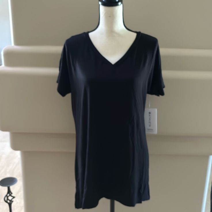 Athleta Nighttime Bliss Sleep Cya Tee. Cya Length. Black. Xs. Have Many Bliss Sleep Pieces On My Site. Other Colors Too! These Are Wonderfully Soft And Very Breathable. Stretch V-neck Sleep Top, Black Athleisure T-shirt For Loungewear, Black Go-dry Tops For Loungewear, Black V-neck Activewear, Black Moisture-wicking Top For Loungewear, Sporty V-neck Loungewear Activewear, Sporty V-neck Activewear, Black V-neck Sleepwear For Relaxation, Black Short Sleeve Activewear For Loungewear