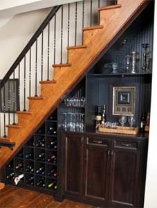 an image of a wine rack under the stairs