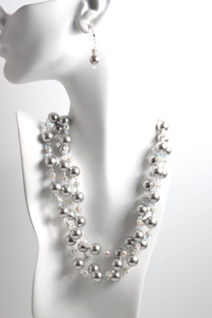 Our Silver Elegance necklace is a stunning accessory that pays tribute to classic elegance with its graceful, cascading strands of pearls, rhinestones and crystals. Featuring gorgeous Swarovski© glass pearls in different hues, a sparkling rhinestone ball and Swarovski© Crystals. Silver chain is adjustable ready to fit any outfit. Make it your own, and wear it in any way that suits you. Elegant Double Strand Crystal Necklaces, Elegant Bridal Necklace With Pearl Chain And Crystal, Elegant Pearl Necklace With Sparkling Stones, Elegant Crystal Pearl Necklace For Party, Silver Beaded Necklace With Rhinestones For Wedding, Elegant Silver Beaded Necklace With Rhinestones, Silver Crystal Pearl Necklace For Party, Elegant Silver Beaded Necklaces With Rhinestones, Elegant Beaded Necklaces With Rhinestones For Jewelry Making