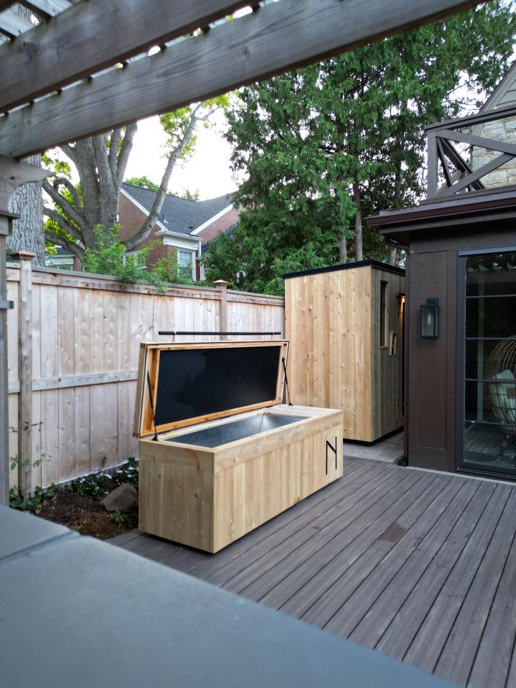 a hot tub sitting on top of a wooden deck