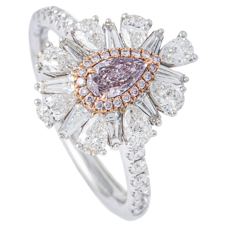 Fancy Pink Purple Diamond White Gold 18K Ring. GIA certificate: GIA, 0.31 carats fancy pink-purple, I1, natural. Ring Size: 52.5 / 6.25 US. Total weight: 4.05 grams. Luxury Purple Rings Gia Certified, Luxury Gia Certified Pink Sapphire Diamond Ring, Luxury Purple Gia Certified Rings, Luxury Pink Platinum Rings, Elegant Pink Diamond Ring In Platinum, Luxury Pink Diamond Ring With Halo Design, Pink Gia Certified Diamond Ring For Formal Occasions, Pink Diamond Cut Diamond Ring, Luxury Pink Halo Diamond Ring