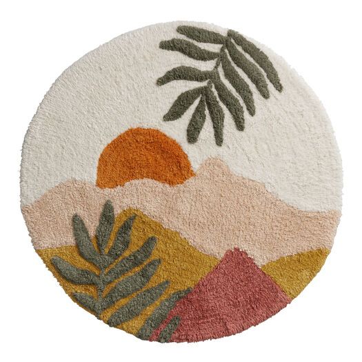 a round rug with plants and mountains in the background, on a white floor mat