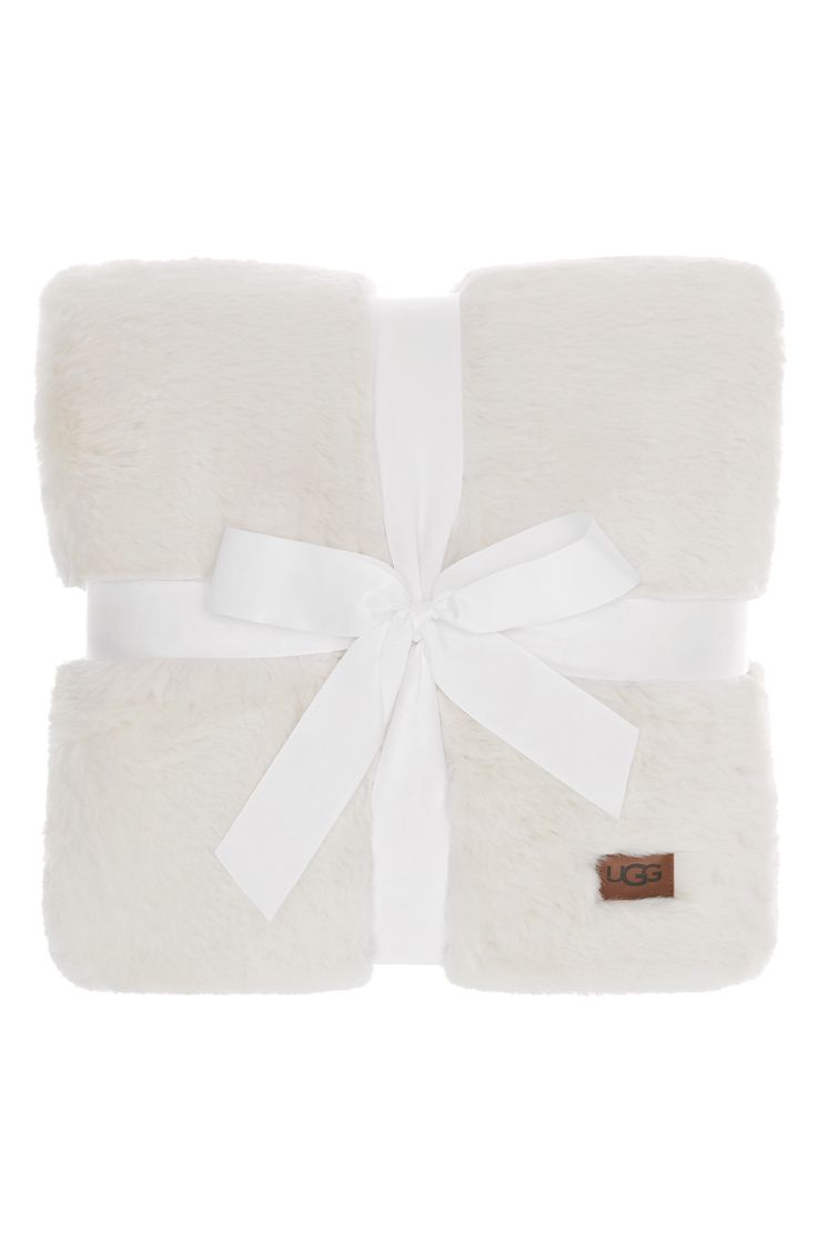 a white blanket with a bow on it