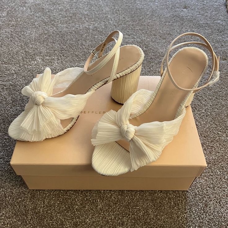 Loeffler Randall Camellia Heels In A Size 9.5 M. Ivory Pleated Uppers With Adorable Bows. Brand New In Box, Never Worn. Authentic! Originally $395. Chic Wedding Shoes With 4-inch Heel, Feminine Summer Wedding Shoes With 4-inch Heel, Chic Spring Wedding Shoes With Sculpted Heel, Spring Wedding Shoes With Padded Block Heel, Chic Wedding Shoes With Sculpted Heel For Spring, Chic Spring Wedding Shoes With Padded Heel, Elegant Spring Wedding Shoes With Block Heel, Chic White Block Heels For Party, Elegant Spring Wedding Shoes With Stacked Heel