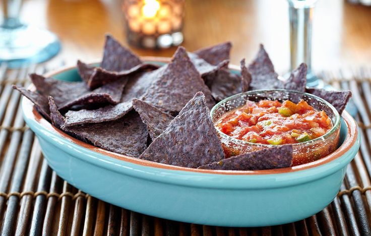 a bowl filled with salsa and tortilla chips