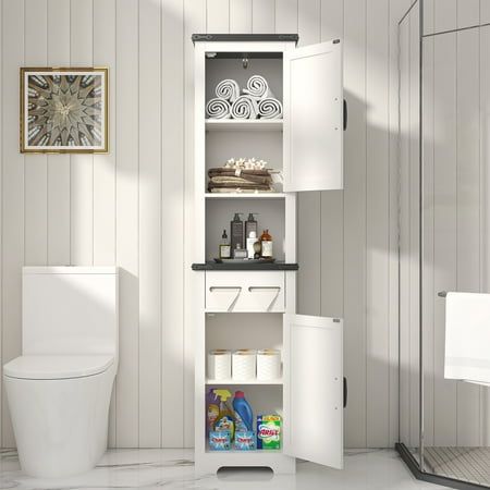 a white toilet sitting next to a walk in shower and a cabinet with items on it