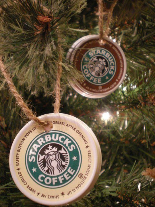 two starbucks christmas ornaments hanging from a tree